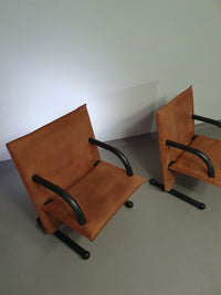 2 post-modern T-line armchairs