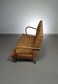 Vintage French papercord sofa with a metal frame base
