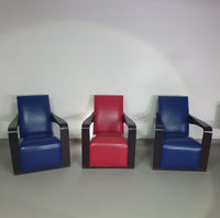 4 x Vintage Ying lounge chairs / fauteuils van Hugues Chevalier, jaren 1990. 3 x blauw / 1 x rood leer. Speciaal gemaakt in deze kleuren voor Tommy Hilfiger. Met gebruikssporen.