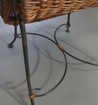 Small side table / chair with elegantly curved wrought iron legs enhanced by a woven rattan seat and top
