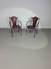 24 chairs in leather and solid wrought iron