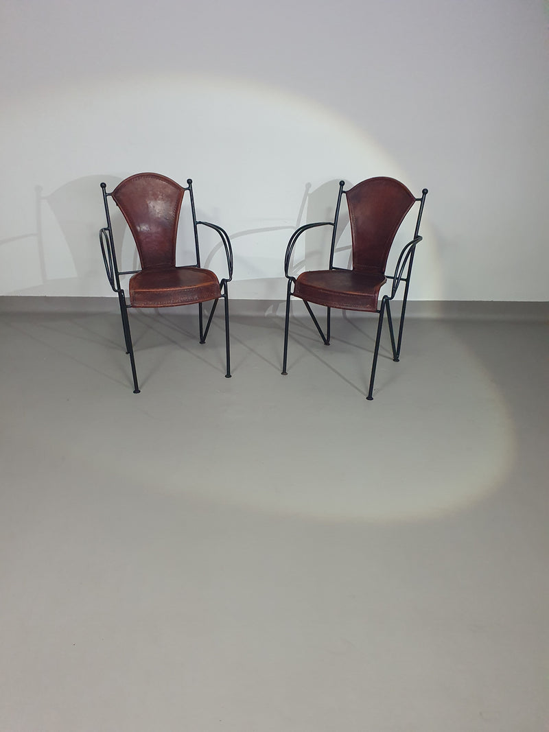 24 chairs in leather and solid wrought iron