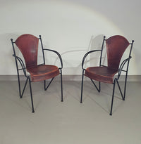 24 chairs in leather and solid wrought iron