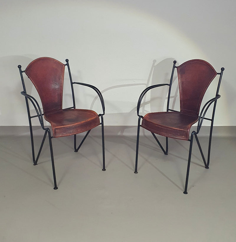 24 chairs in leather and solid wrought iron
