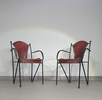 24 chairs in leather and solid wrought iron