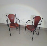 24 chairs in leather and solid wrought iron