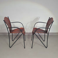 24 chairs in leather and solid wrought iron