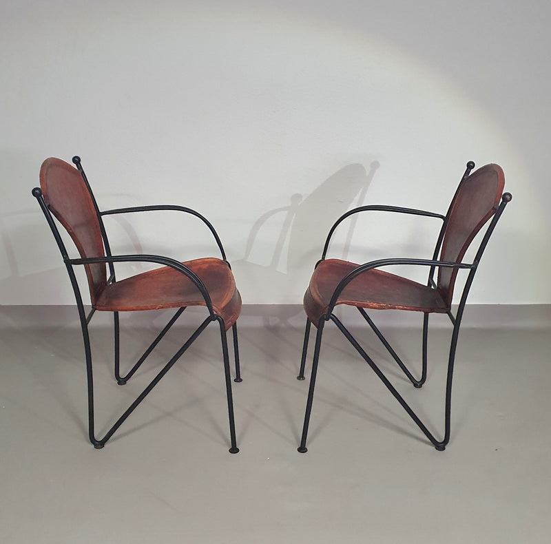 24 chairs in leather and solid wrought iron