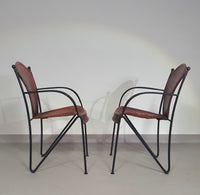 24 chairs in leather and solid wrought iron