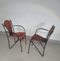 24 chairs in leather and solid wrought iron