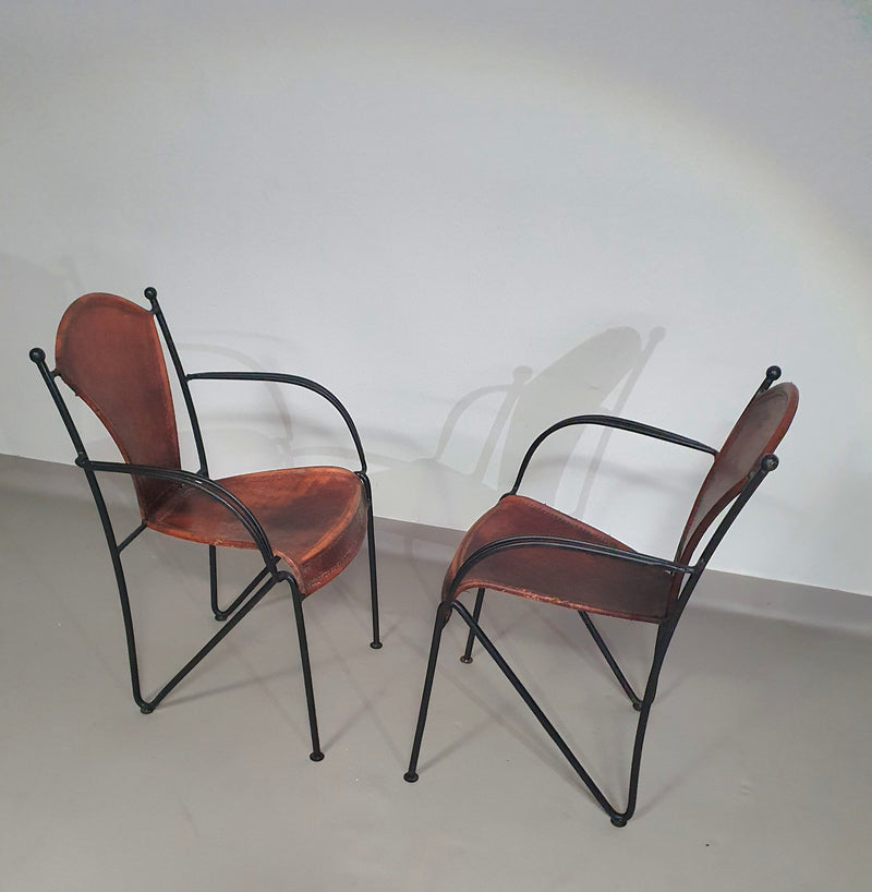 24 chairs in leather and solid wrought iron