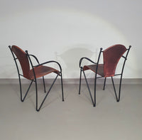 24 chairs in leather and solid wrought iron