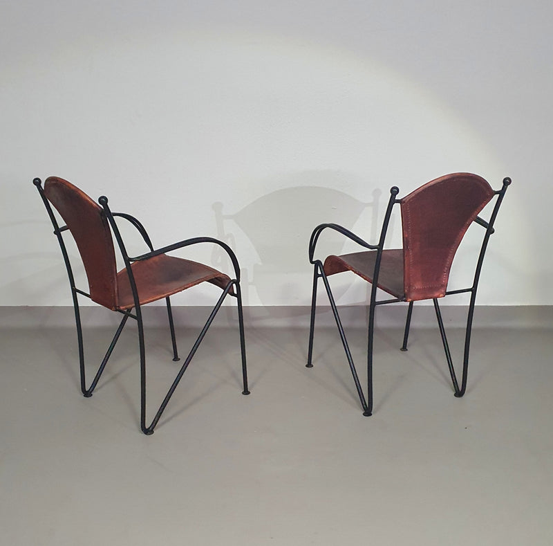 24 chairs in leather and solid wrought iron