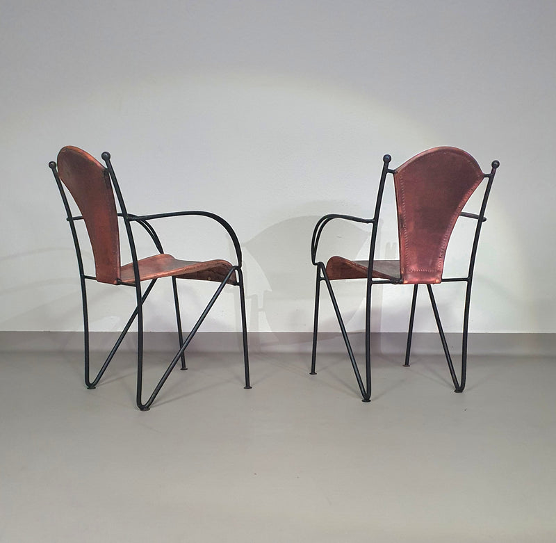 24 chairs in leather and solid wrought iron
