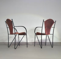 24 chairs in leather and solid wrought iron