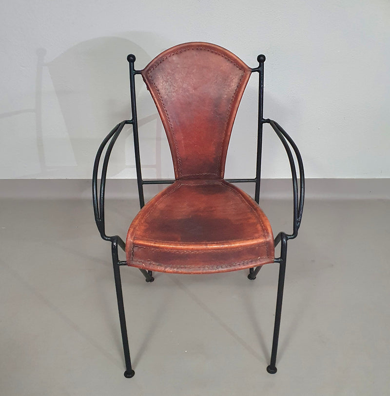 24 chairs in leather and solid wrought iron