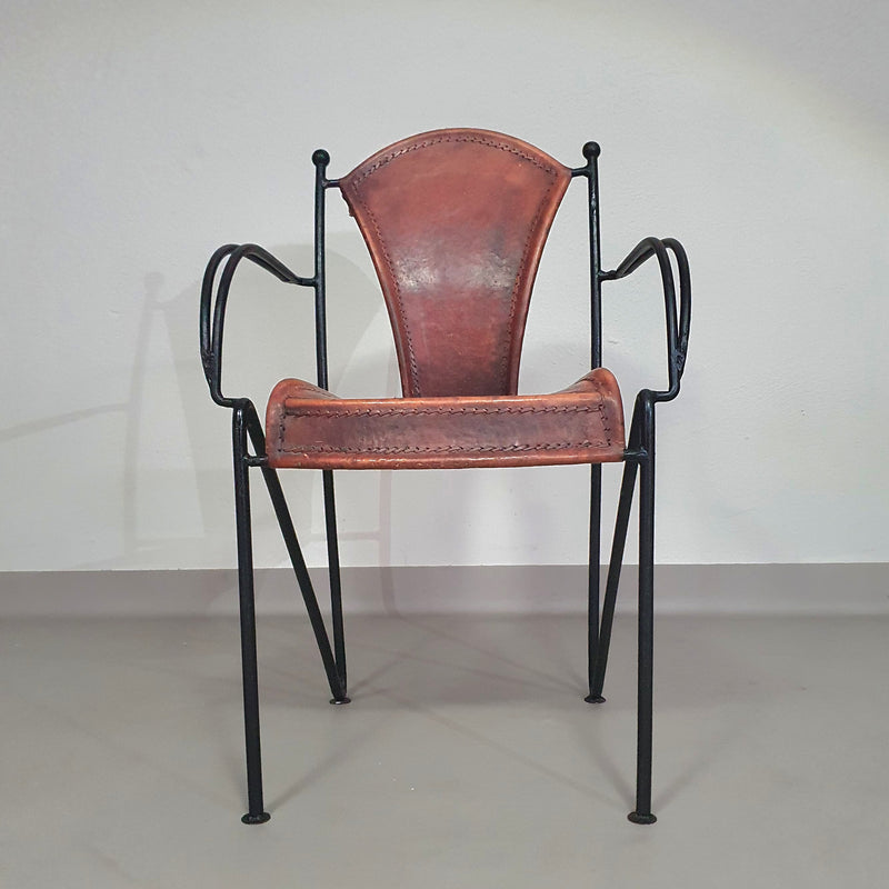 24 chairs in leather and solid wrought iron