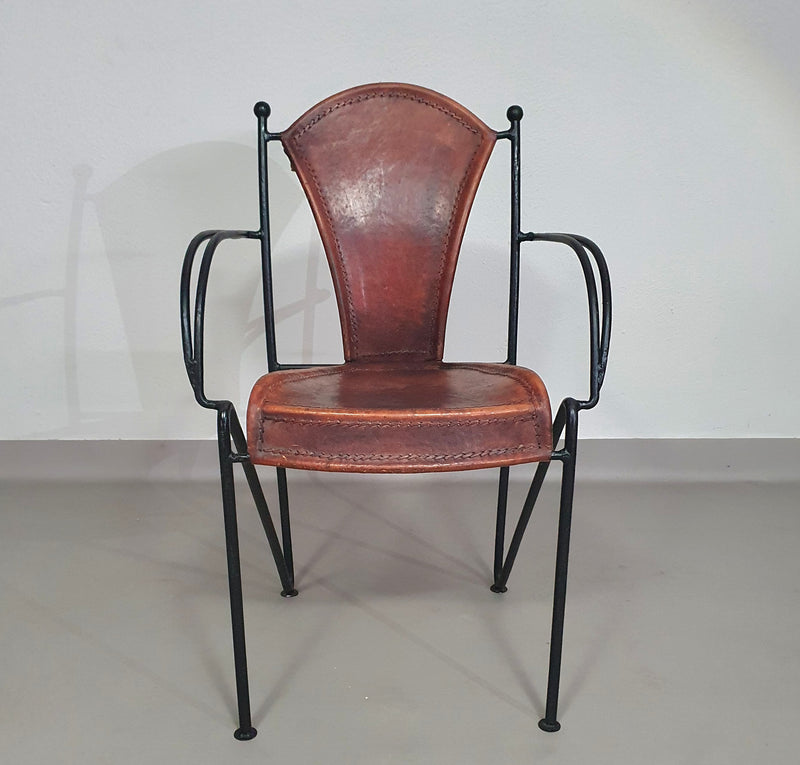 24 chairs in leather and solid wrought iron