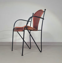 24 chairs in leather and solid wrought iron