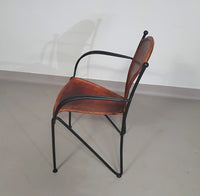 24 chairs in leather and solid wrought iron