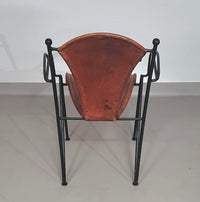 24 chairs in leather and solid wrought iron