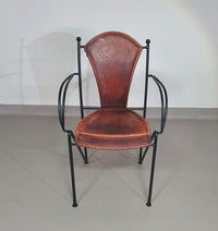 24 chairs in leather and solid wrought iron