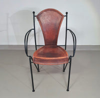 24 chairs in leather and solid wrought iron