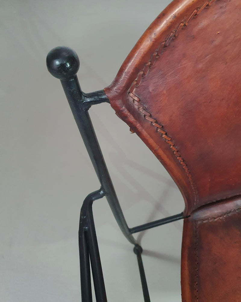 24 chairs in leather and solid wrought iron