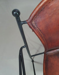 24 chairs in leather and solid wrought iron