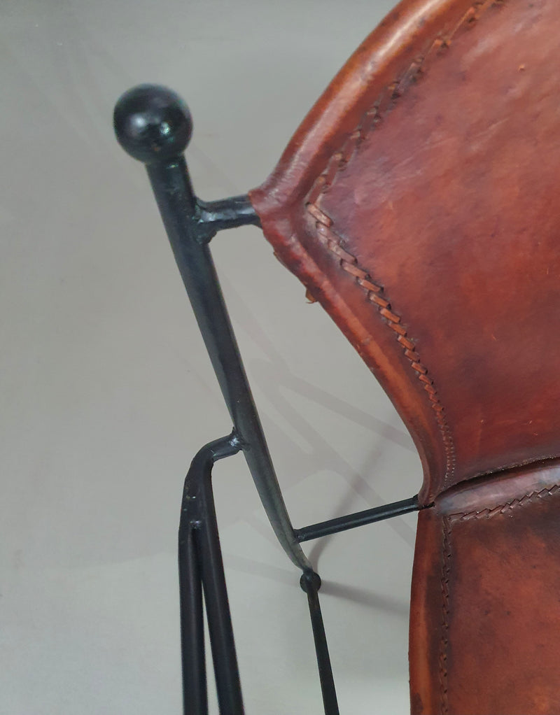 24 chairs in leather and solid wrought iron