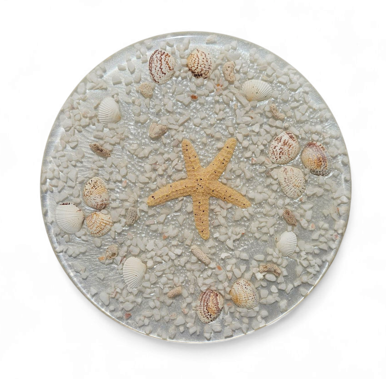 Stools with a decorative top made with sand , seashells, and a starfish embedded in a clear acrylic / 1970s