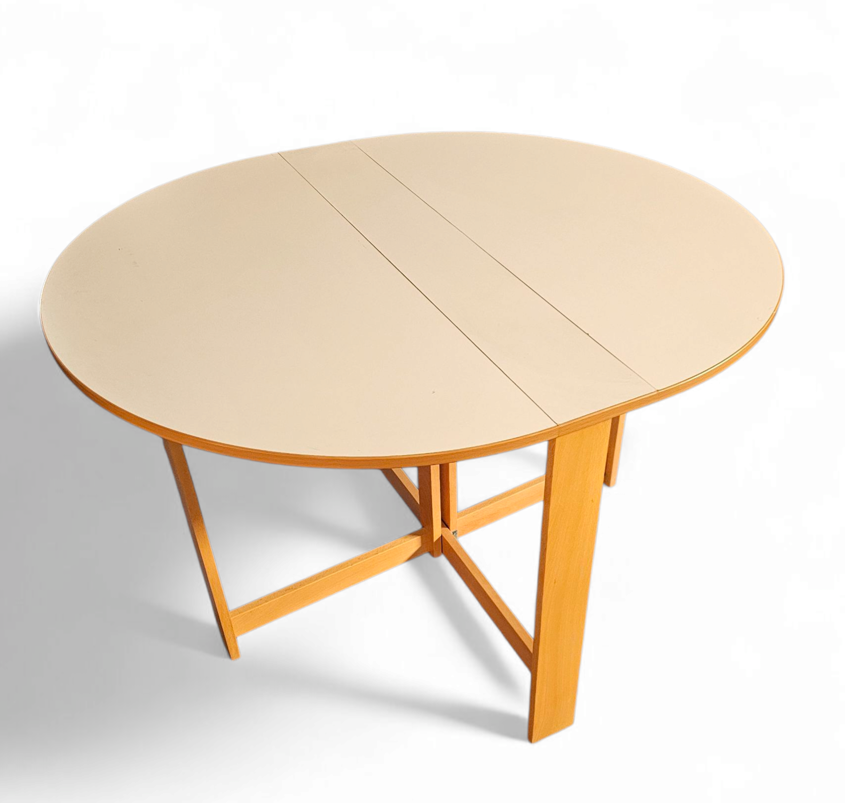 Vintage scandinavian folding dining table with side leaves. The oval top is made of white formica