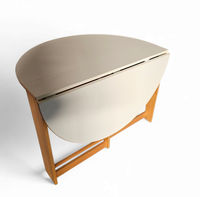 Vintage scandinavian folding dining table with side leaves. The oval top is made of white formica
