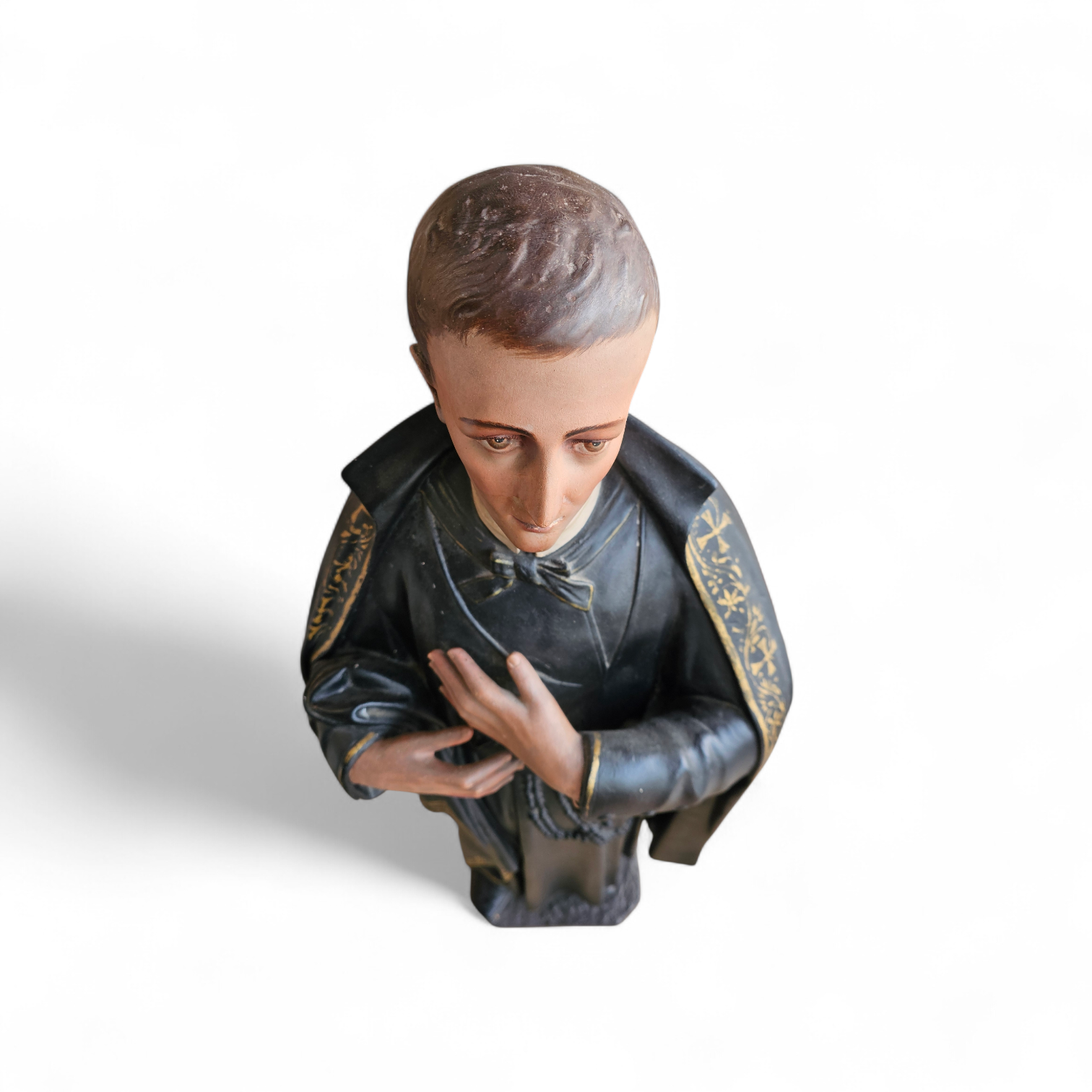 Statue of a religious figure / Patron Saint Gerard Majella / placed in a Gothic niche / labeled /