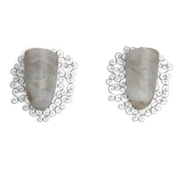 Wrought iron pocket wall sconces featuring a frosted amber glass / metal frame