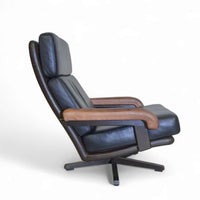 Prachtige vintage design Leolux draaifauteuil, uitgevoerd in bruin/donkerbruin/zwart leer en houten frame