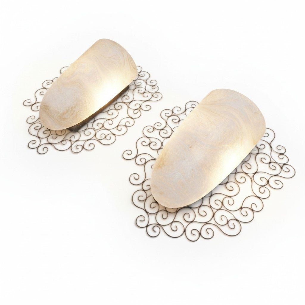 Wrought iron pocket wall sconces featuring a frosted amber glass / metal frame