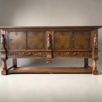 Mechelen Spanish sculptured sideboard / leather covered panels with decorated nails / 1960s