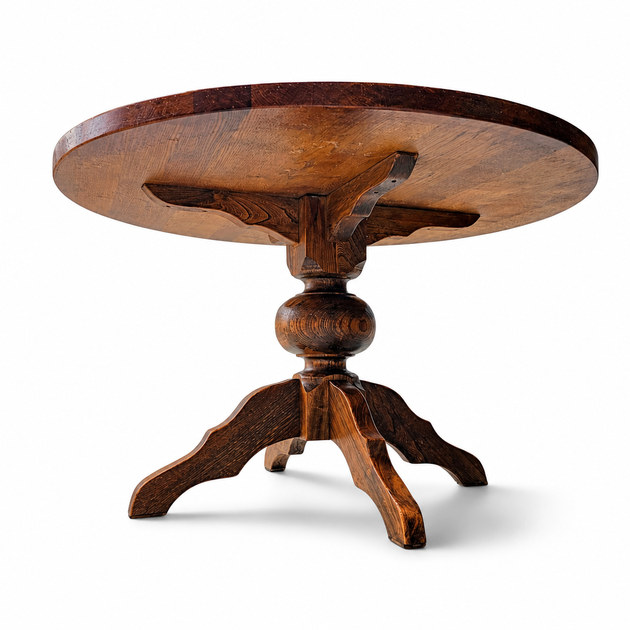 solid oak dining table / also known as a monastery table / with a sturdy central pedestal / Its heavy-duty construction