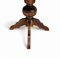 solid oak dining table / also known as a monastery table / with a sturdy central pedestal / Its heavy-duty construction