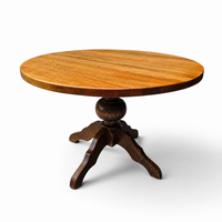 solid oak dining table / also known as a monastery table / with a sturdy central pedestal / Its heavy-duty construction