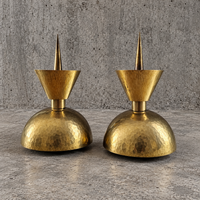 2 x Postmodern brass hammered diabolo shaped candles / height 26 cm / 1970s