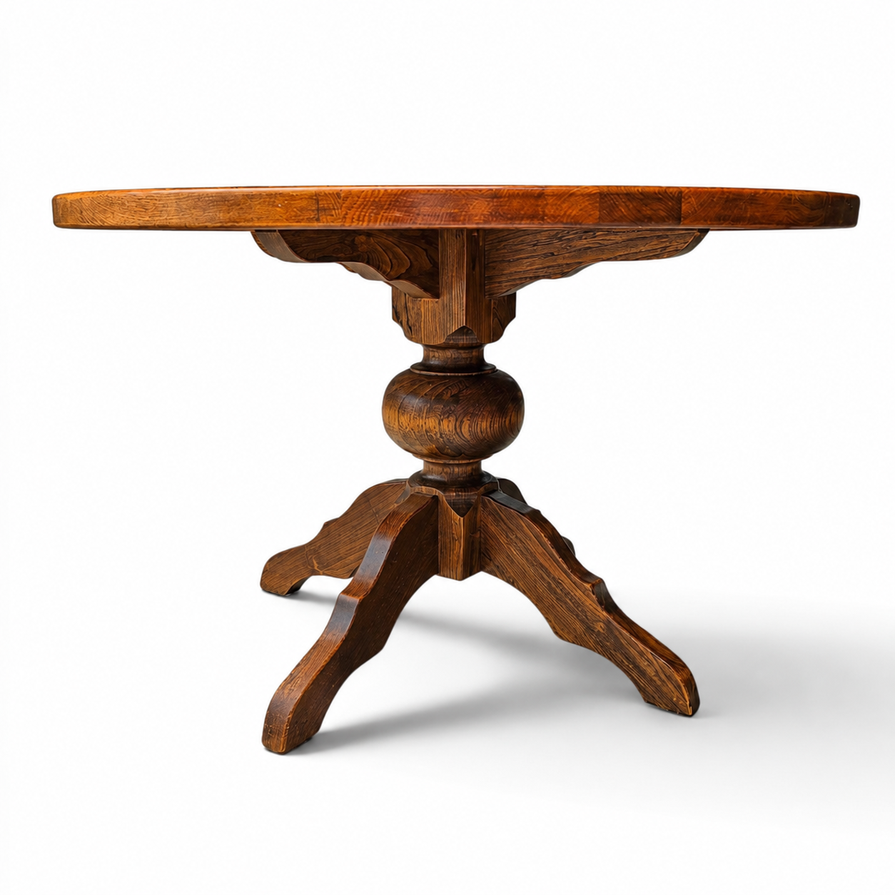 solid oak dining table / also known as a monastery table / with a sturdy central pedestal / Its heavy-duty construction