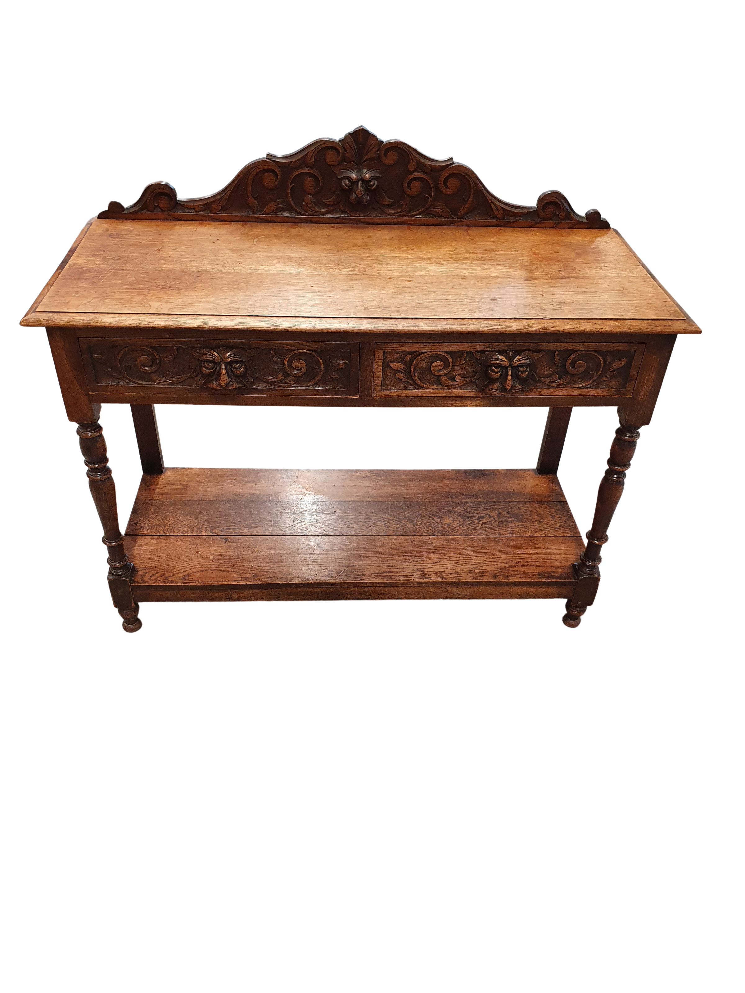Victorian Gothic Oak side table, decorative carved round 1920. Green Mask decoration