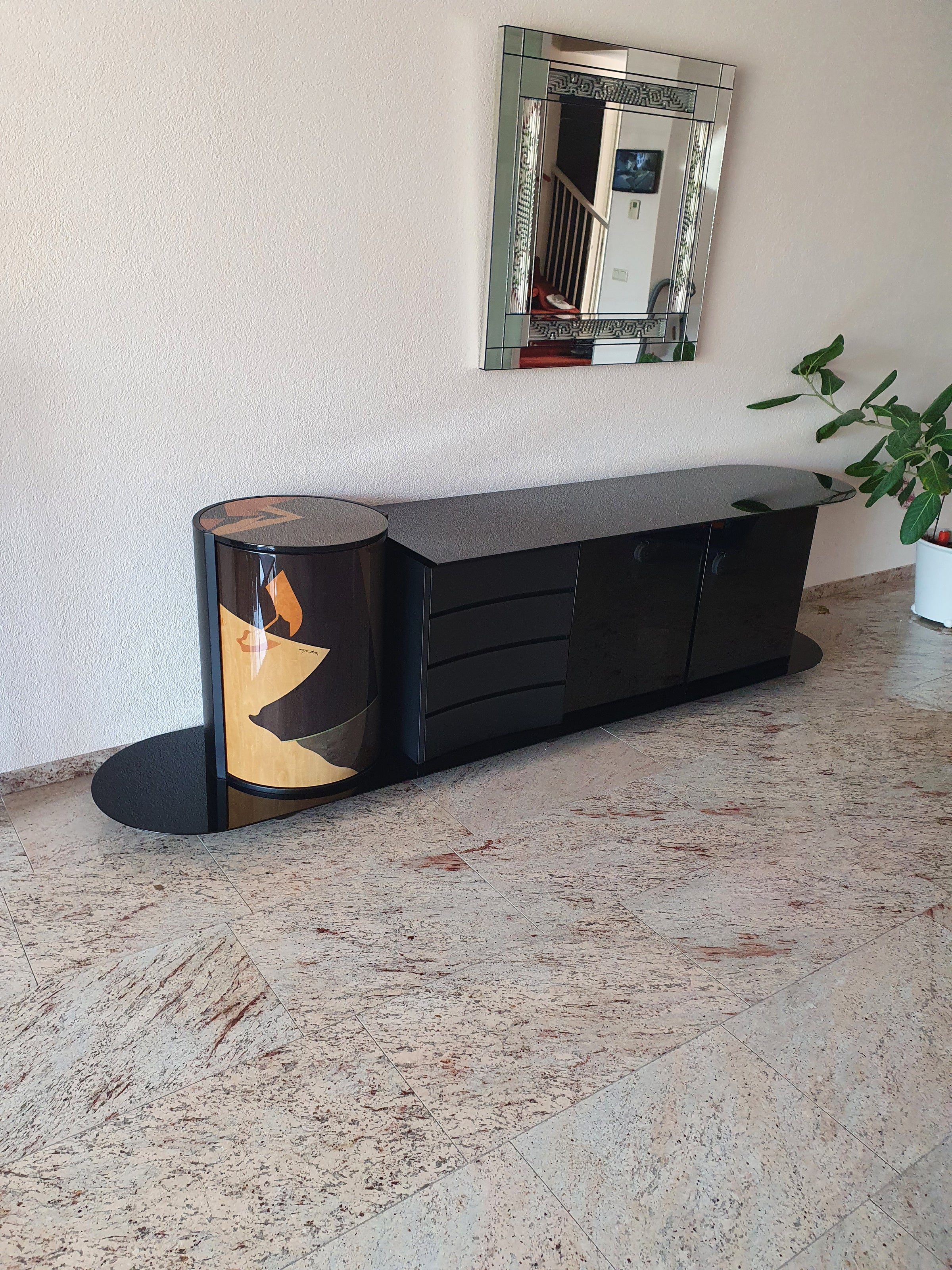 Unique dressoir by Carlo Malnati, produced around the 1980’s. The art work is made out of inlaid wood, using different colored pieces to create the design. 260 x 77 x 70 deep